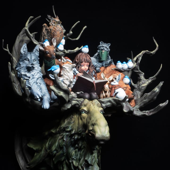 Forest Friends — a girl reading among woodland animals atop a mossy elk, painted miniature diorama